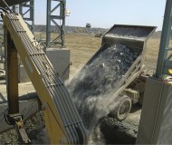 Komatsu_HD785_truck_dumping_ore_into_crusher_at_Phoenix_Nickel-1.jpg